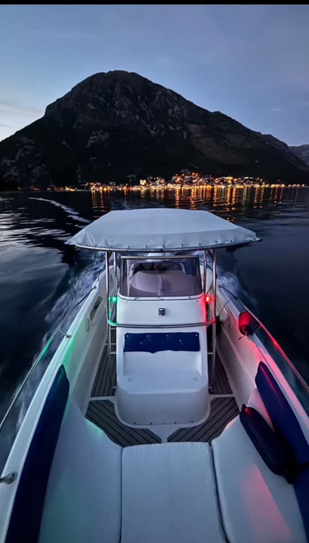 A boat on calm Boka Bay waters, speedboat private tours 